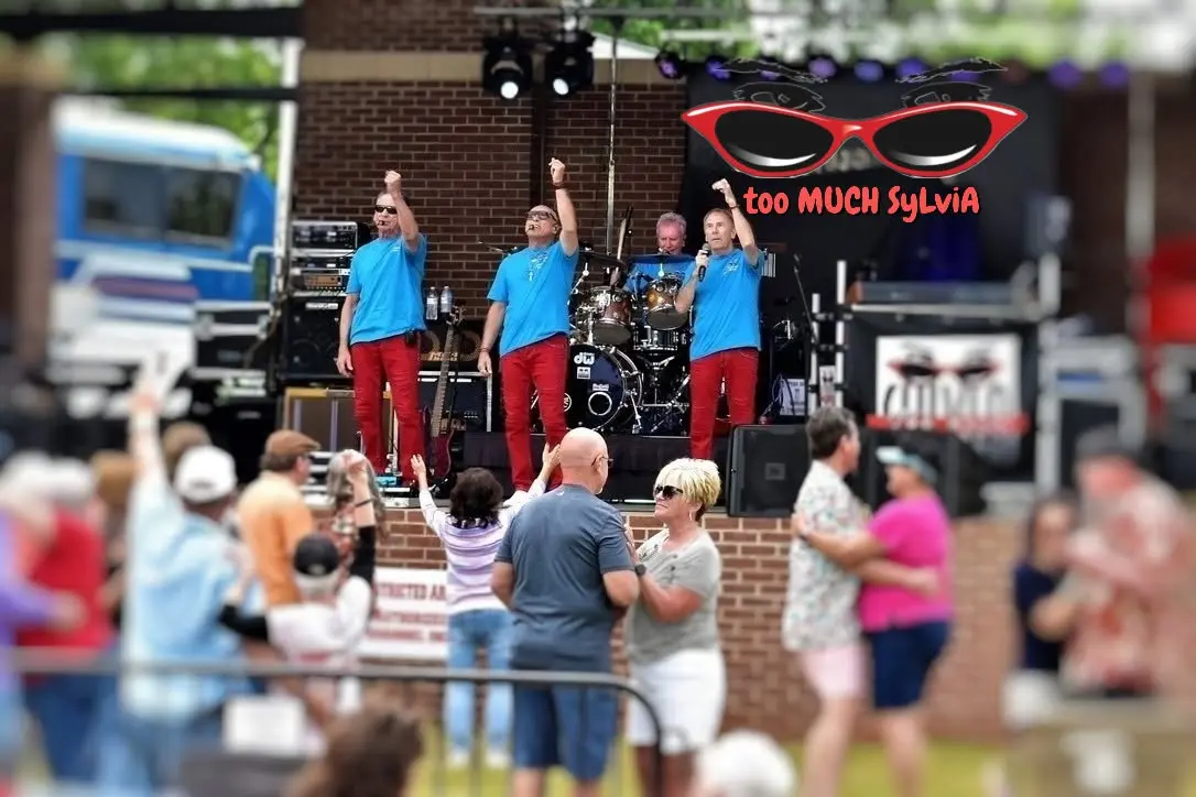 Too Much Sylvia red sunglasses logo
